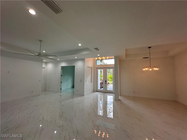 spare room featuring ceiling fan and french doors