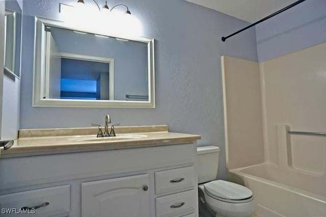 full bathroom featuring vanity,  shower combination, and toilet