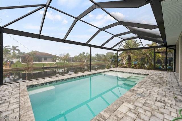 view of pool with a lanai, a water view, and a patio