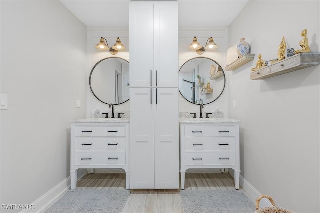 bathroom featuring hardwood / wood-style floors and vanity