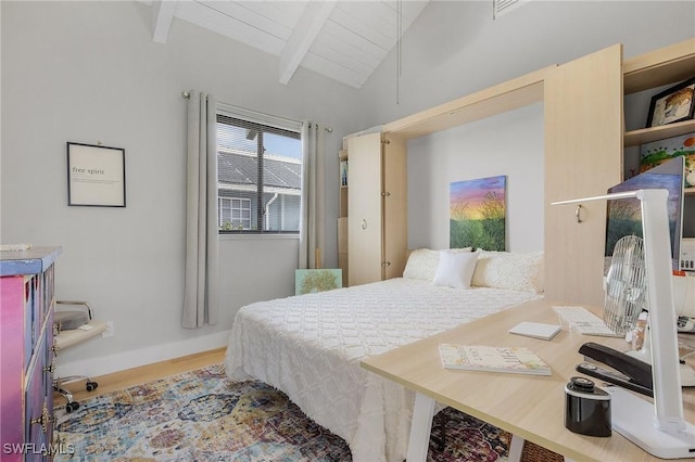 bedroom with wood-type flooring, lofted ceiling with beams, and wood ceiling