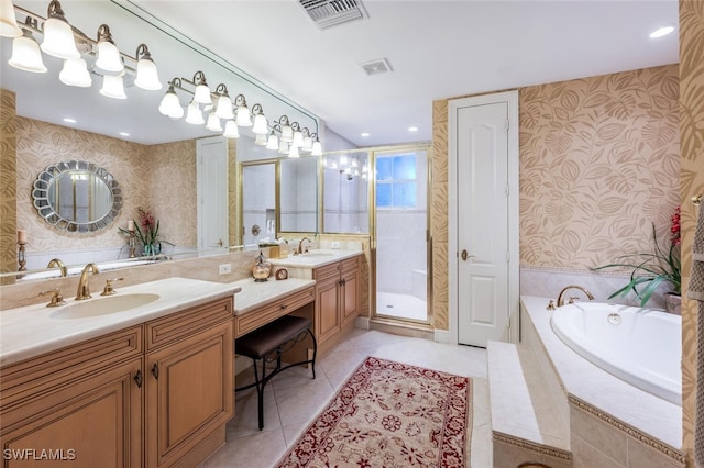 bathroom with tile patterned flooring, vanity, and independent shower and bath