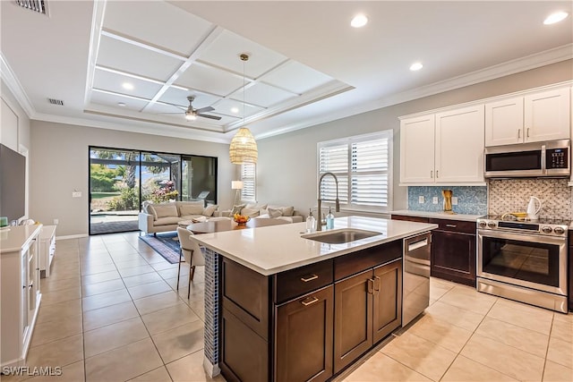 kitchen with white cabinets, sink, ceiling fan, light tile patterned flooring, and stainless steel appliances