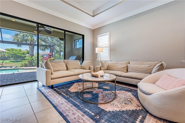 living room featuring ceiling fan, crown molding, and light tile patterned flooring