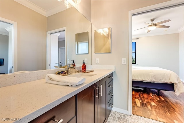 bathroom with tile patterned flooring, vanity, ceiling fan, and crown molding