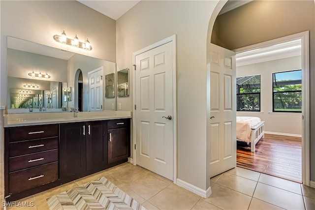 bathroom with tile patterned flooring and vanity