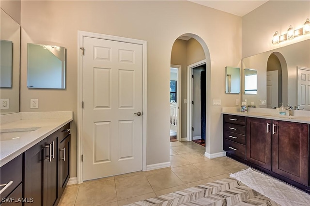 bathroom with tile patterned floors and vanity