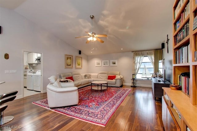 living room featuring separate washer and dryer, ceiling fan, dark hardwood / wood-style flooring, and lofted ceiling