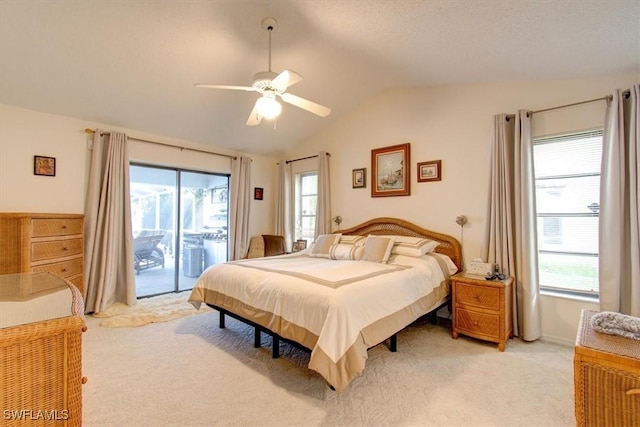 bedroom featuring access to exterior, multiple windows, vaulted ceiling, and ceiling fan