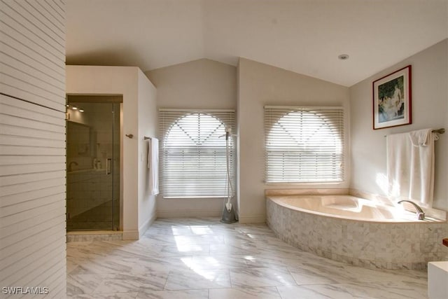 bathroom with vaulted ceiling and independent shower and bath