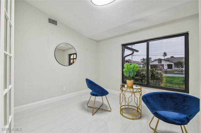 living area featuring vaulted ceiling