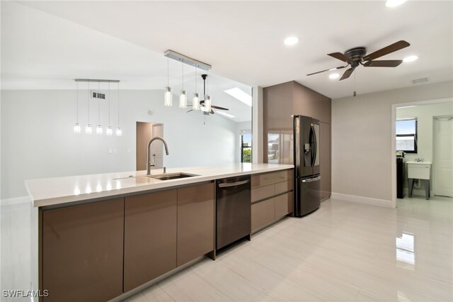 kitchen featuring appliances with stainless steel finishes, ceiling fan, sink, hanging light fixtures, and lofted ceiling