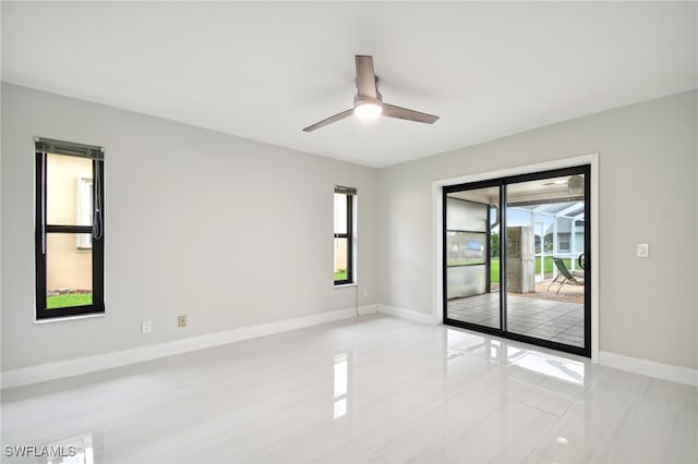 unfurnished room with ceiling fan