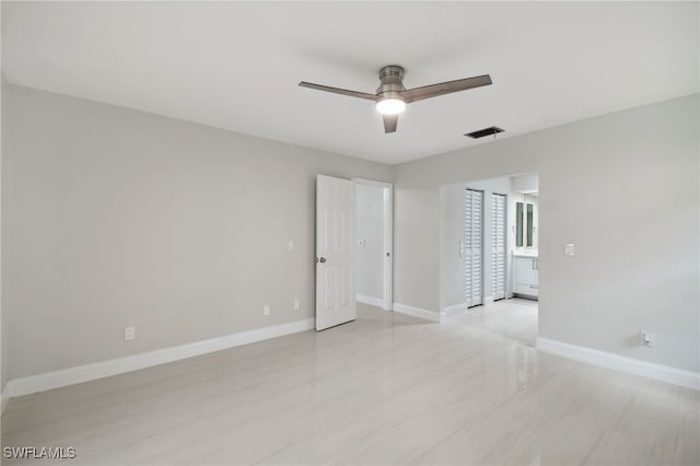 spare room with ceiling fan