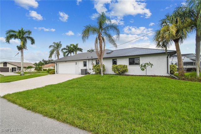 ranch-style house with central AC unit, a garage, and a front lawn