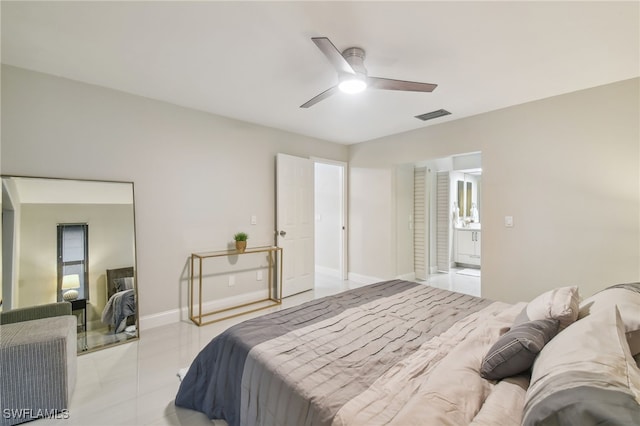 tiled bedroom featuring ceiling fan