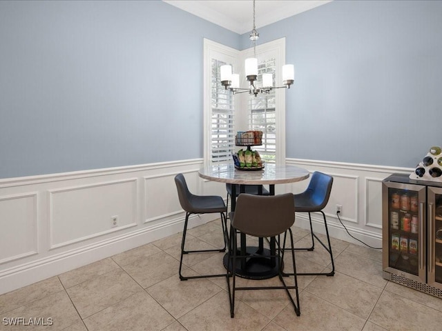 dining room featuring an inviting chandelier, light tile patterned floors, and beverage cooler