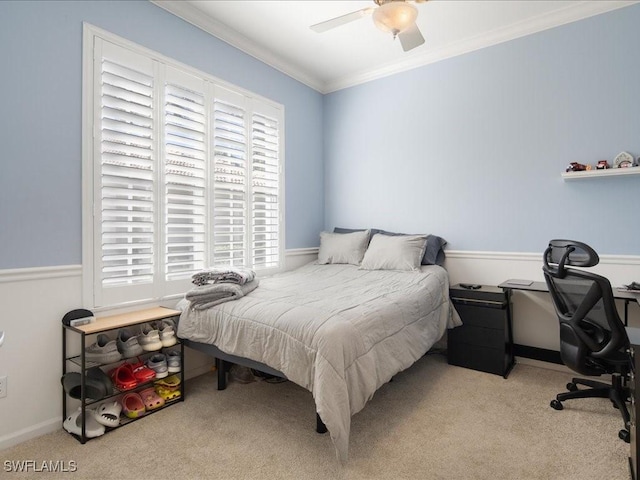 bedroom with crown molding, light colored carpet, and ceiling fan