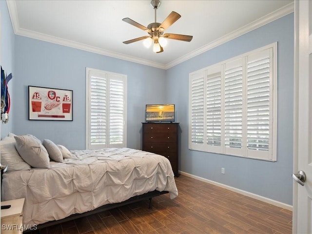 bedroom with hardwood / wood-style flooring, crown molding, and ceiling fan