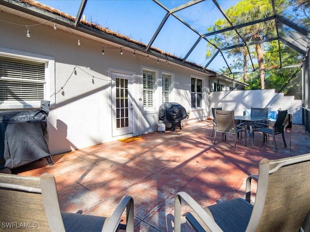 deck featuring area for grilling, a lanai, and a patio area