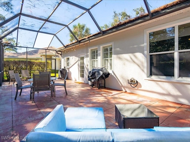 view of patio / terrace with a grill and a lanai