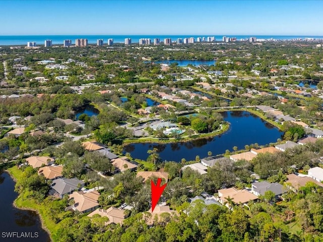 birds eye view of property featuring a water view