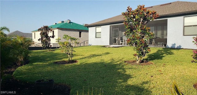 view of yard featuring a sunroom