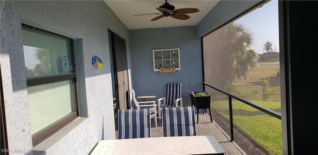 sunroom / solarium with ceiling fan