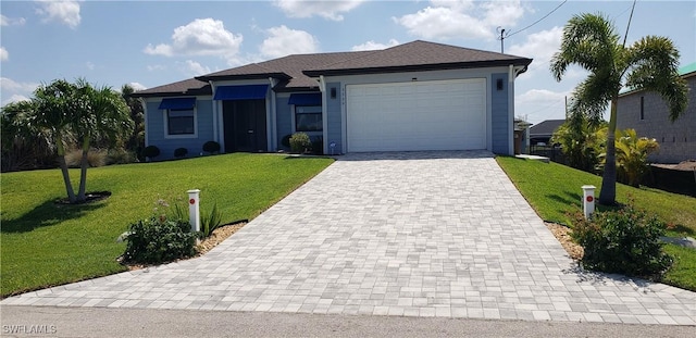 single story home with a front yard and a garage