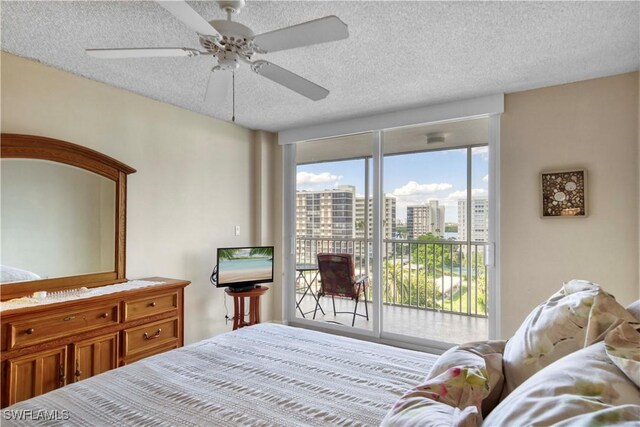 bedroom with access to exterior, a textured ceiling, and ceiling fan