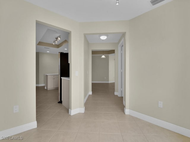 hallway featuring light tile patterned floors