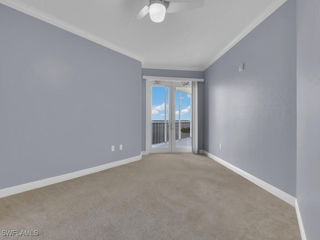 unfurnished room featuring ceiling fan, ornamental molding, light carpet, and french doors