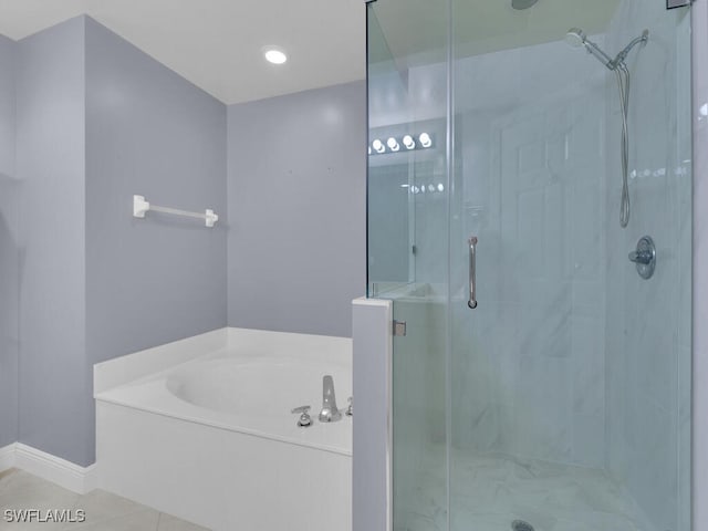 bathroom featuring tile patterned flooring and plus walk in shower