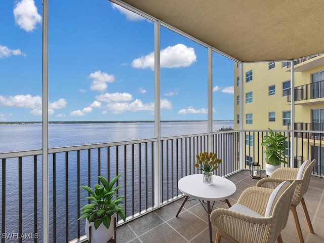 balcony featuring a water view