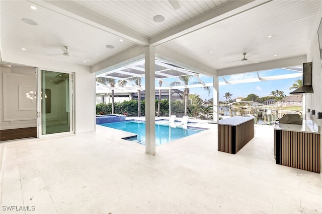 view of swimming pool with glass enclosure, an in ground hot tub, area for grilling, and a patio