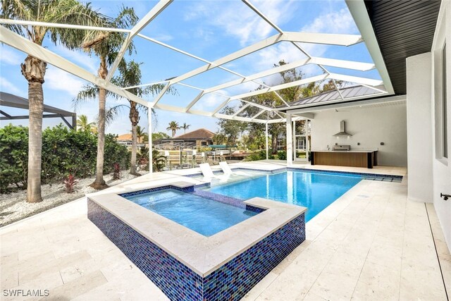 view of swimming pool featuring a lanai, an in ground hot tub, and a patio