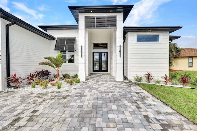 property entrance featuring french doors