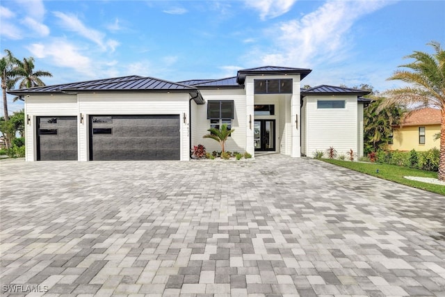 prairie-style home featuring a garage