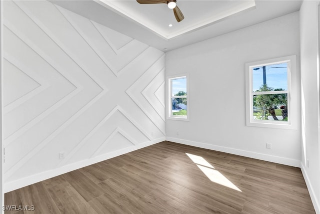 unfurnished room featuring hardwood / wood-style flooring and ceiling fan