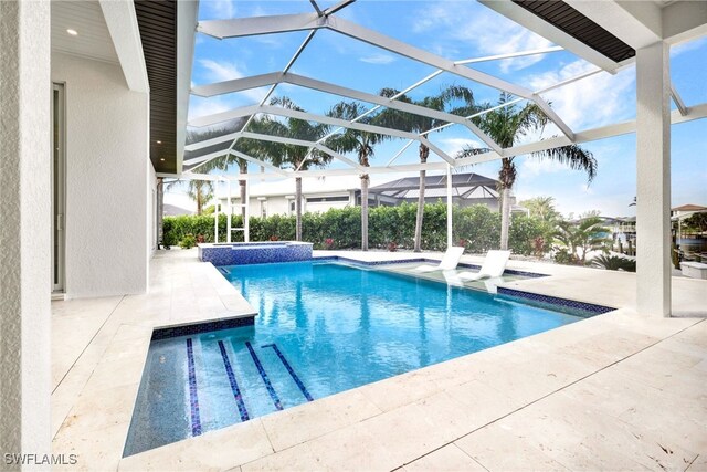 view of pool featuring a patio and a lanai