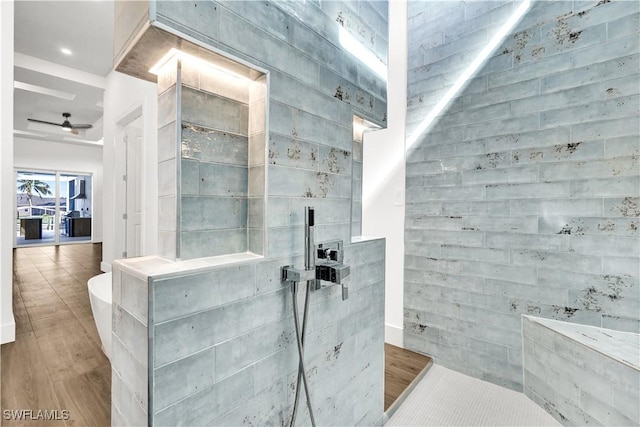 bathroom with wood finished floors, walk in shower, and a ceiling fan