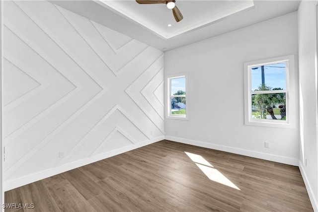 bonus room with ceiling fan, baseboards, and wood finished floors