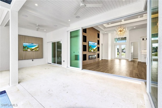 view of patio featuring ceiling fan and french doors