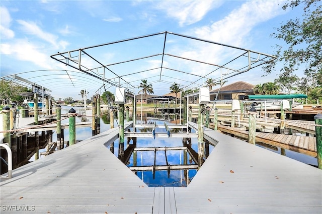 view of dock with a water view and boat lift