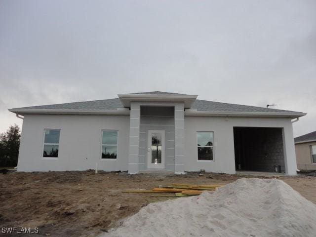 prairie-style house featuring a garage