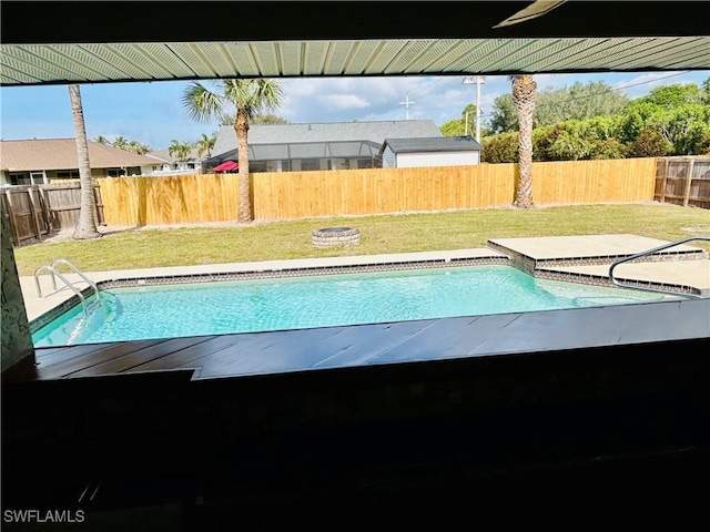 view of pool with a lawn