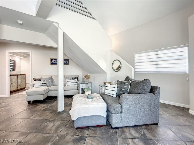 309 Donora Blvd, Fort Myers Beach, FL 33931 - living room featuring lofted ceiling and baseboards