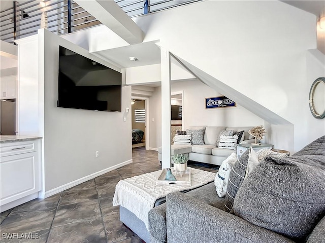 309 Donora Blvd, Fort Myers Beach, FL 33931 - living area with a towering ceiling and baseboards