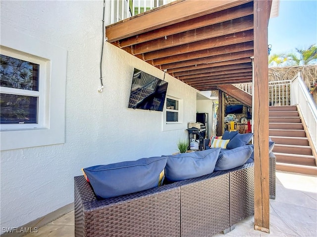 309 Donora Blvd, Fort Myers Beach, FL 33931 - view of patio / terrace with stairway and an outdoor hangout area