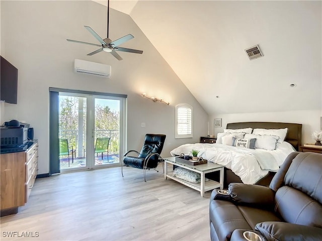 309 Donora Blvd, Fort Myers Beach, FL 33931 - bedroom featuring visible vents, access to outside, light wood-type flooring, high vaulted ceiling, and a wall mounted AC